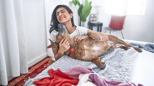 A girl playing with her dog